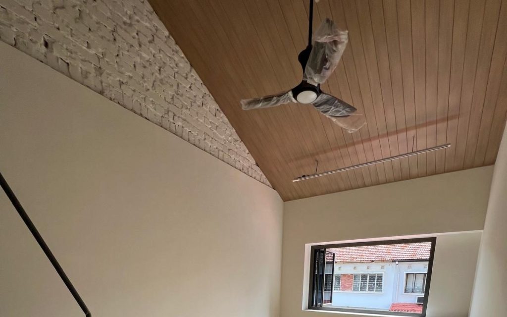 Aluminium ceiling installation with woodgrain finish